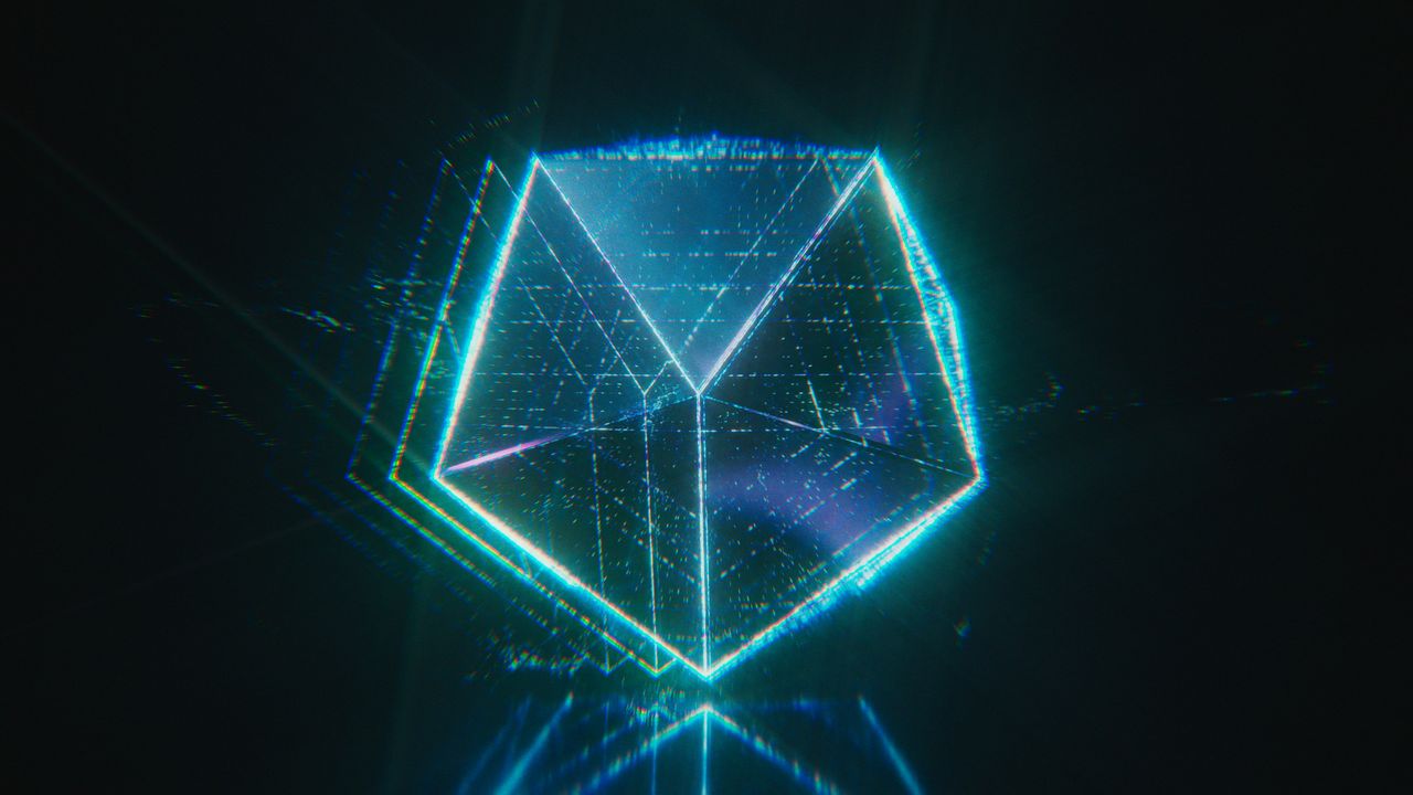 Glowing cyan wireframe cube in a dark virtual environment.